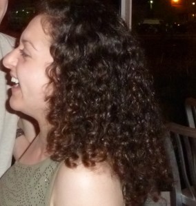 Me! A happy, curly-haired person.