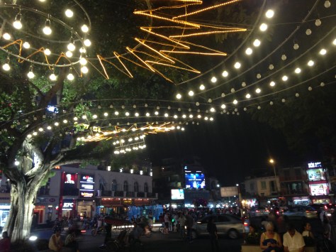 Path around Hoan Kiem Lake by night, with a view of the edge of the Old Quarter